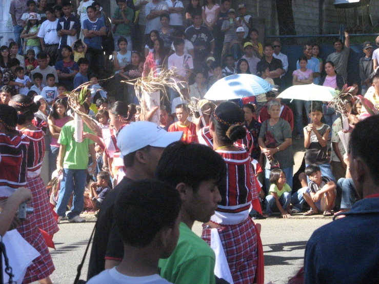 there is a large group of people walking in a parade