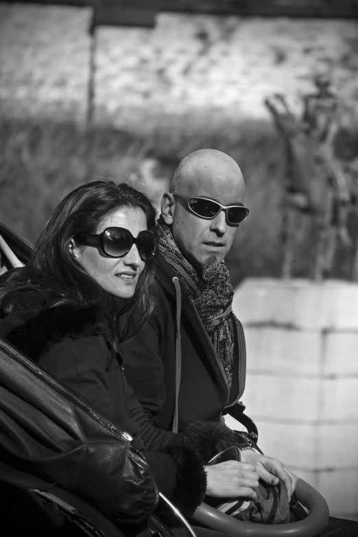 black and white pograph of two people in a car