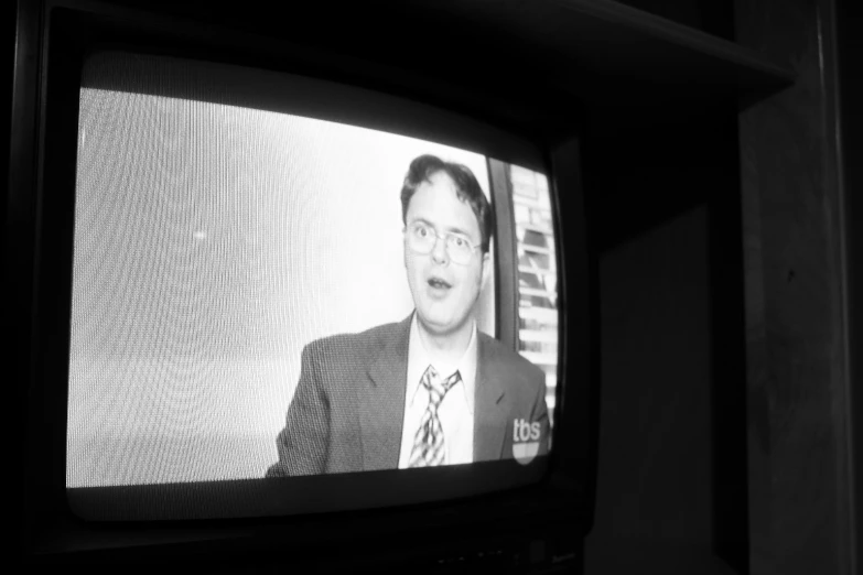 black and white pograph of a man on the tv