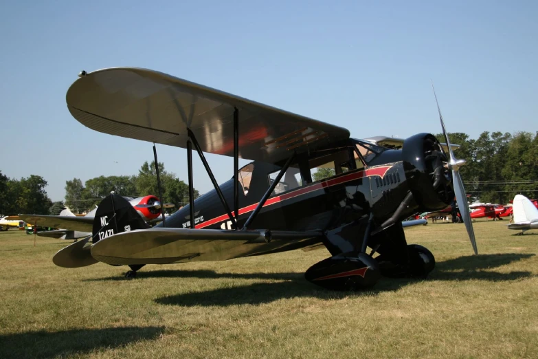 an old - fashioned air plane is on display on a sunny day