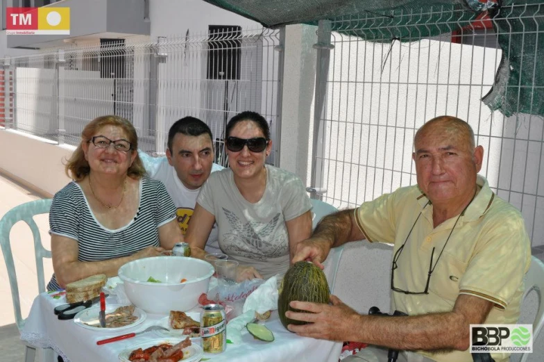 a group of people sitting around a table