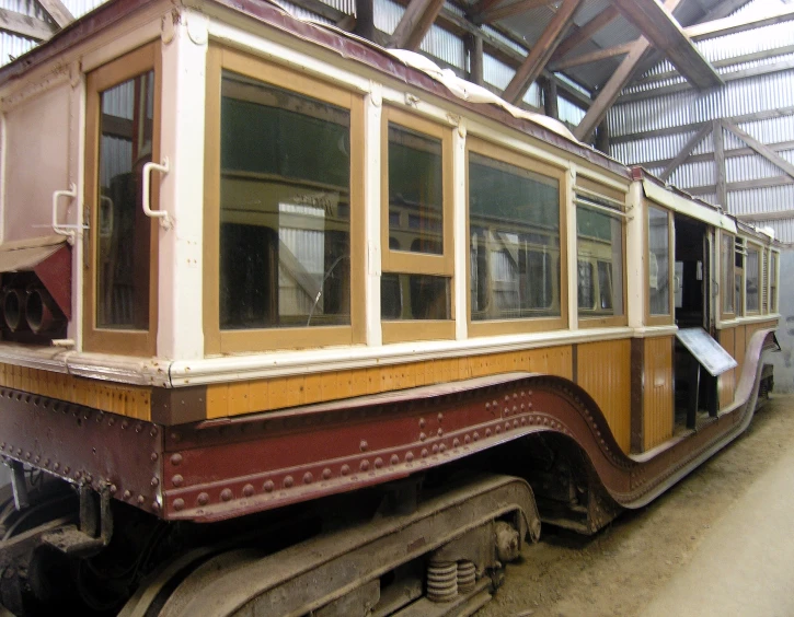 the side of a passenger train in an indoor station