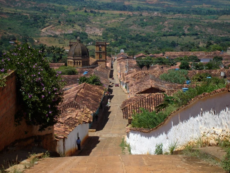 the cobblestone streets have many brown and white buildings