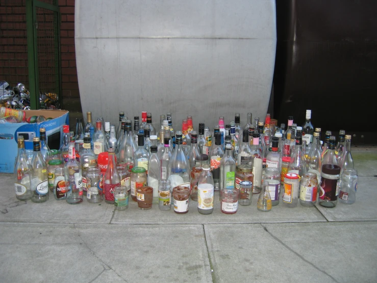 a bunch of liquor bottles that are on the ground