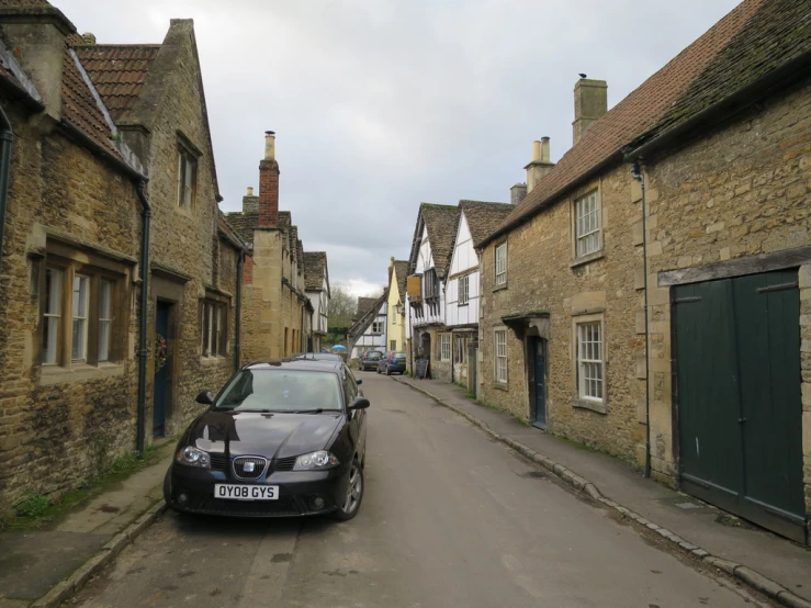 a car parked along the side of a small road