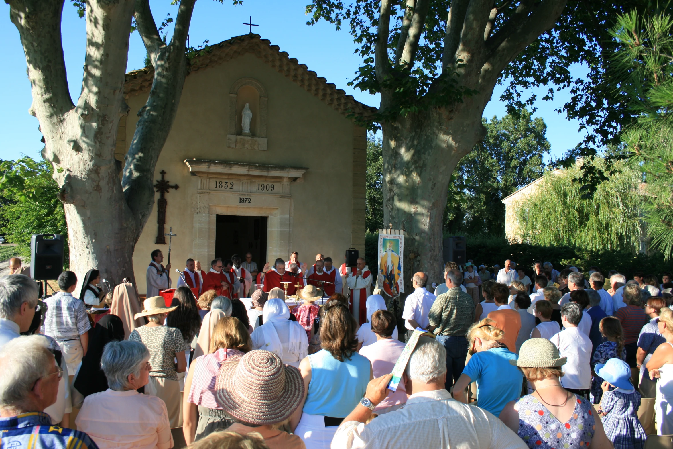 an image of people in a church yard