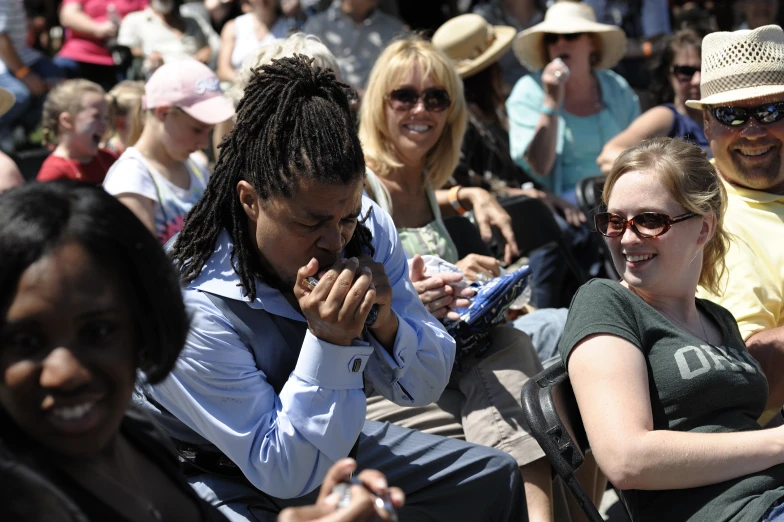 the many people are smiling together outside