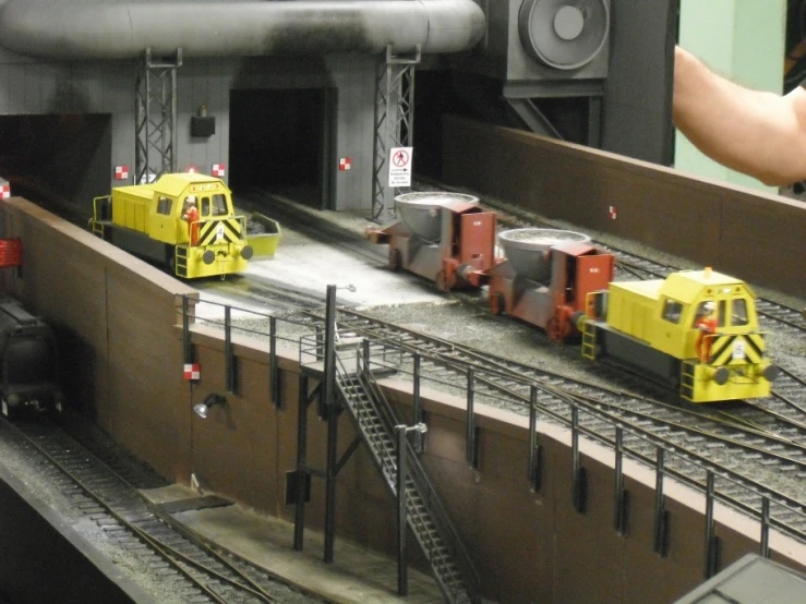 the toys are being placed on the rail line