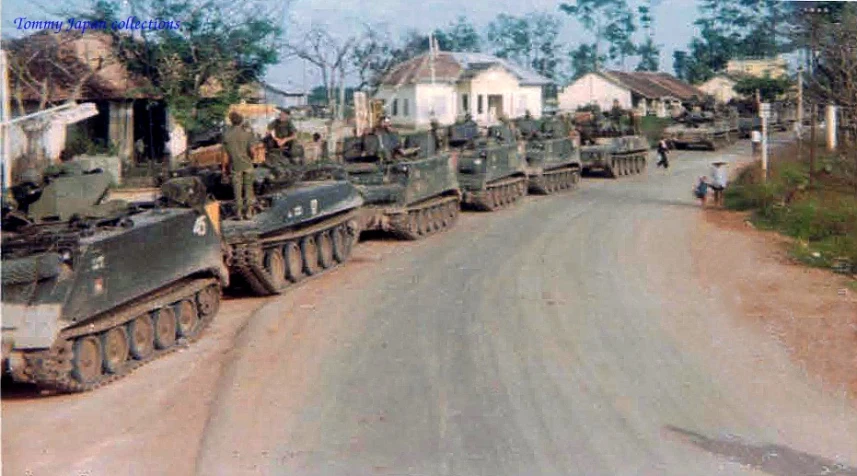 a bunch of tanks that are sitting in the dirt