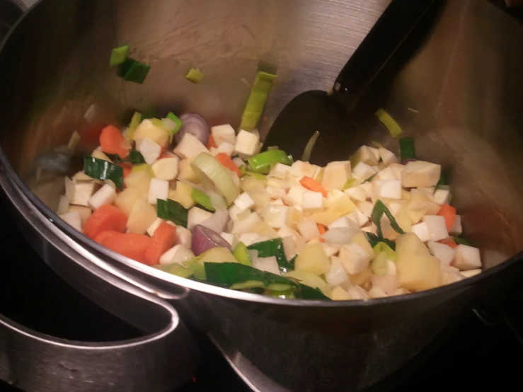 a pot that has food cooking in it