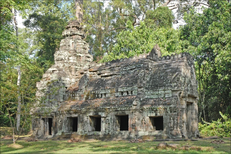 a very old house with a tree in front