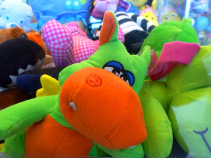 several different color stuffed animals together