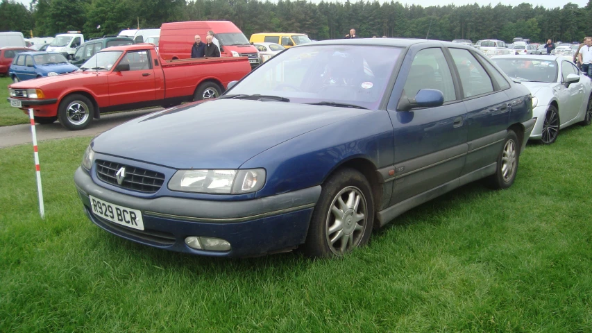 a couple of vehicles that are in the grass