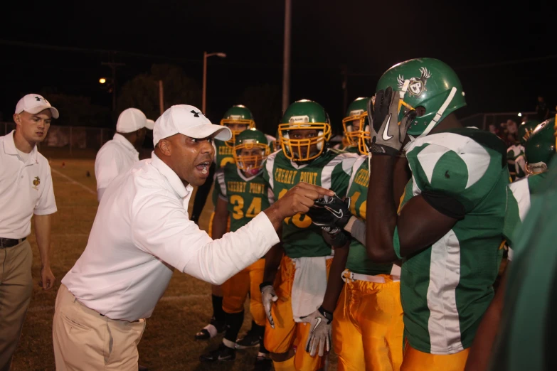 head coach pointing to his team during the game