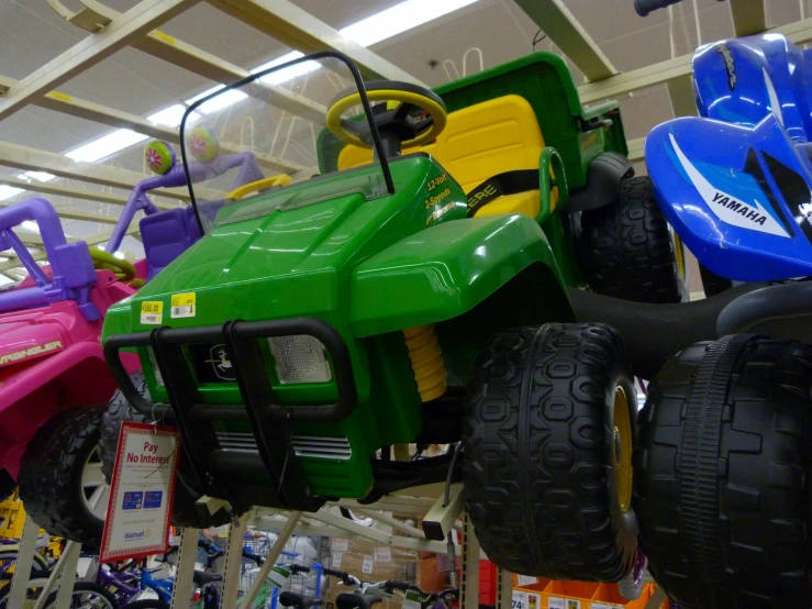 colorful toy vehicles are displayed in a museum