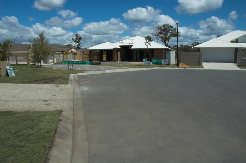 houses are in the foreground with clouds above them