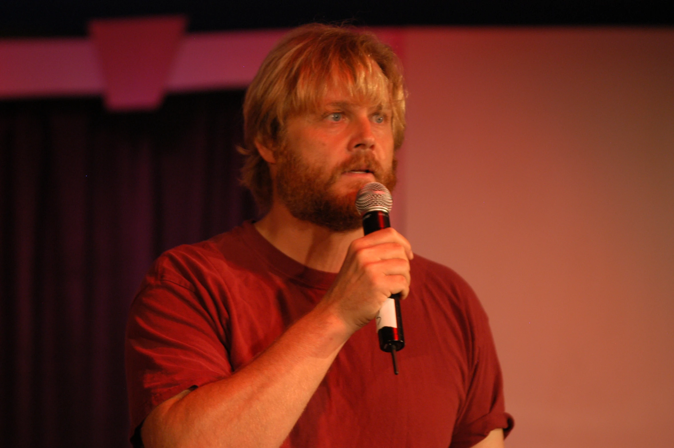 man with microphone and microphone in a dark room