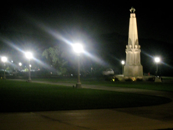 a street light at night in front of a large church