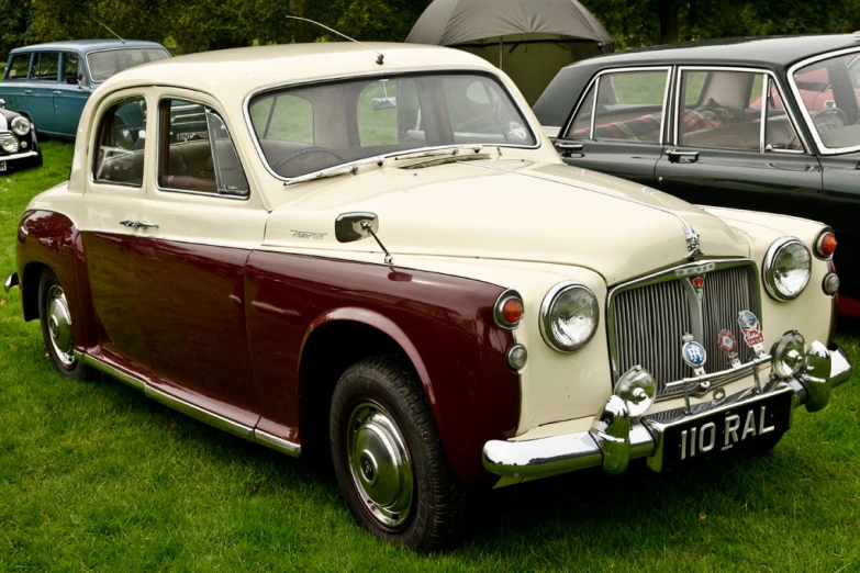 classic cars on display in a grass field