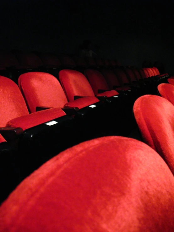 empty red seats with black backrests and two rows