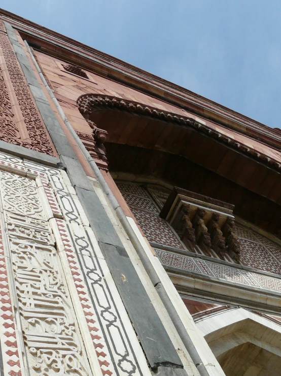 an ornate arch is displayed on a building