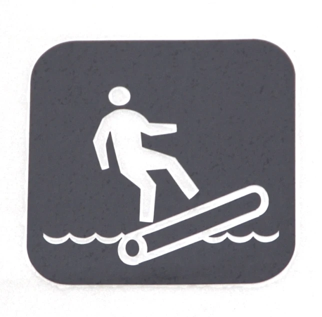 a sticker on a sign shows a skateboarder