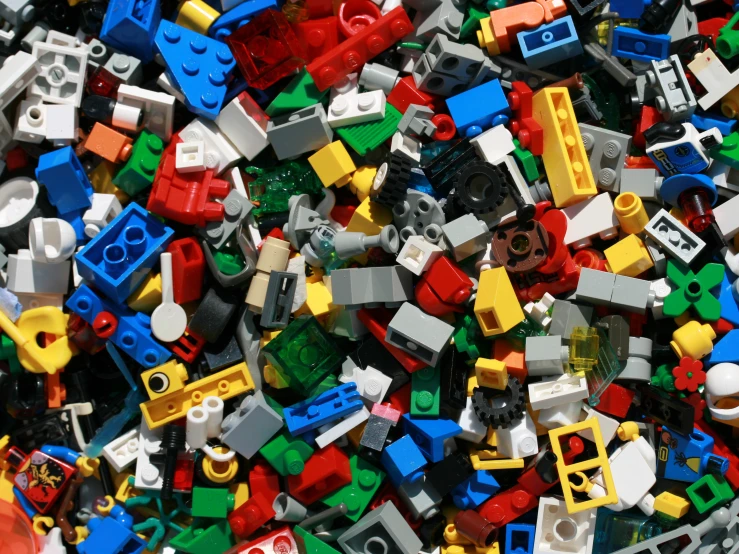 a pile of multicolored legos in the shape of a bunch