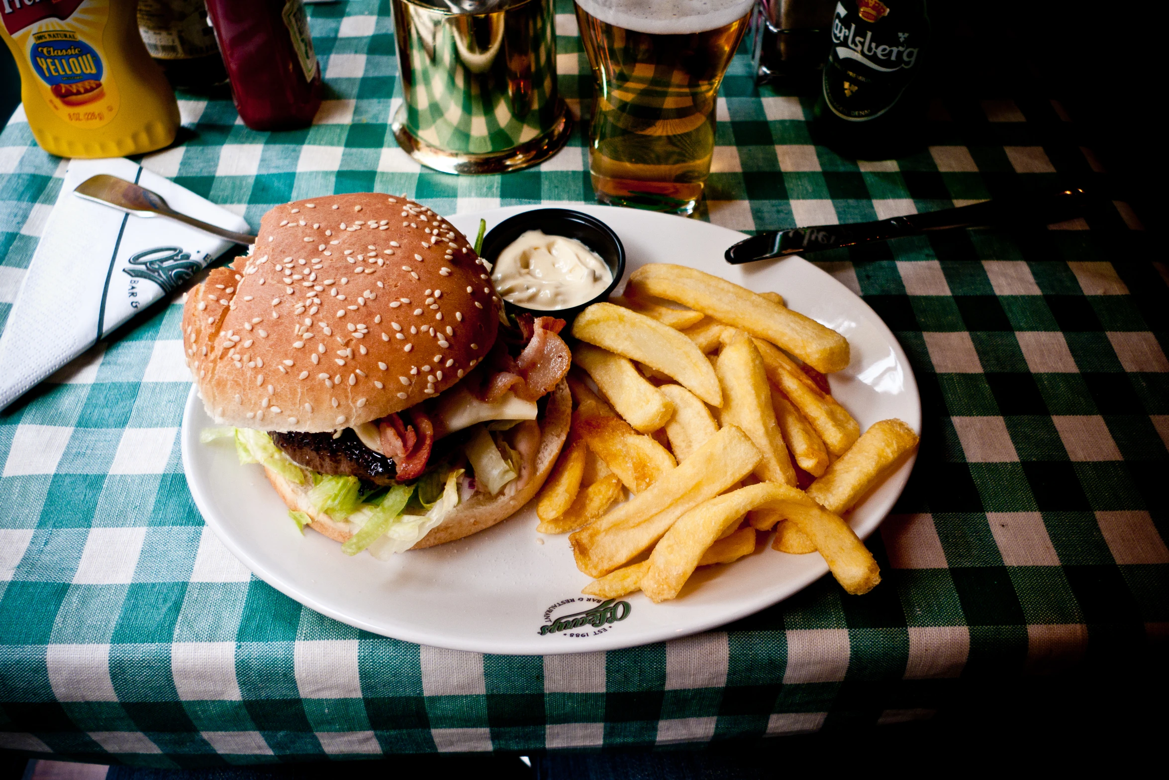 a hamburger and french fries on a plate