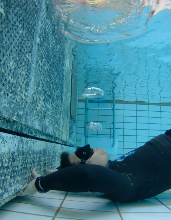 a person taking a pograph with a remote underwater camera