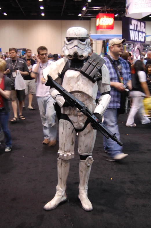 a person in storm trooper costume with guns