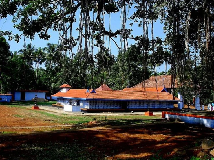 a number of buildings near one another near trees