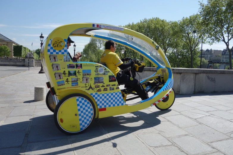 a man riding on a tricycle with advertit for a restaurant