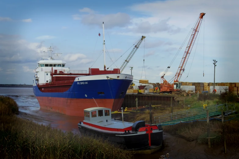 a large ship is sitting at the dock