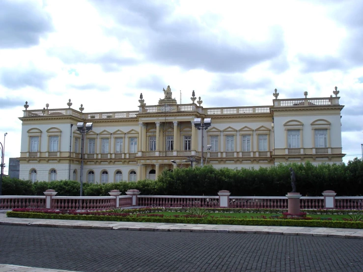 large, two - story house with large garden in front