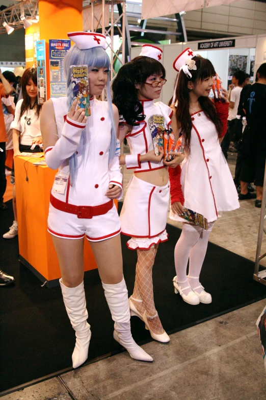 two  girls wearing costumes with long hair posing for pictures