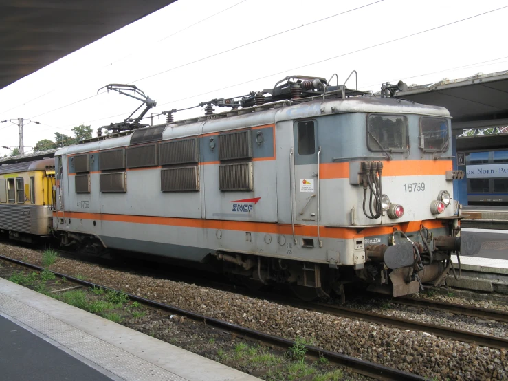 an abandoned train car is at the station