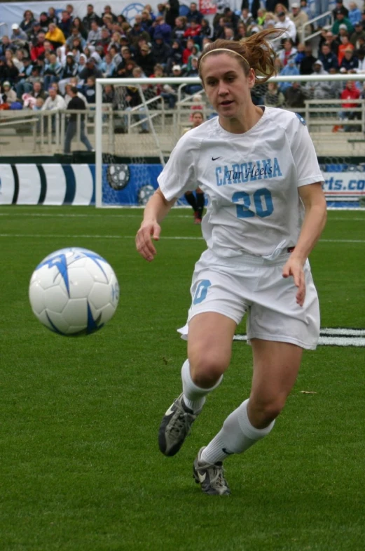 a young female soccer player in action during a game