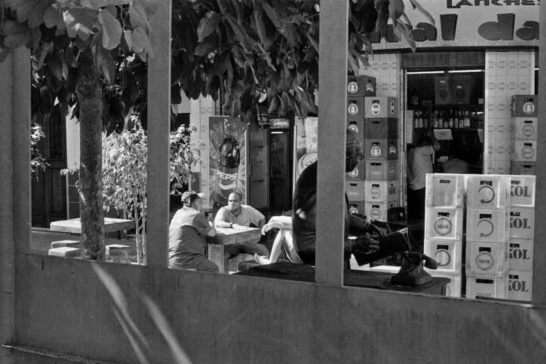 people sit outside at an outdoor cafe