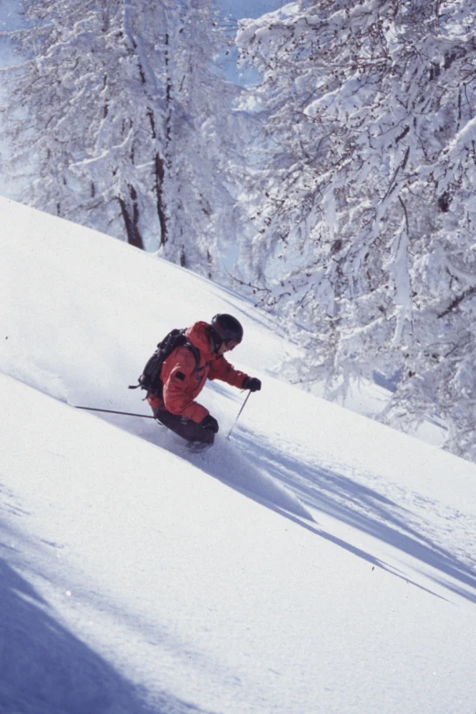 a person on some skis skiing in the snow