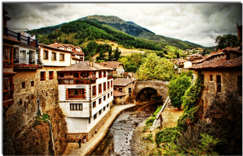 an old building and street in a mountainous area