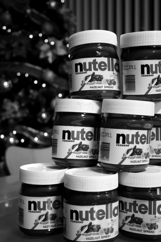 eight jars of nutella are stacked on top of each other