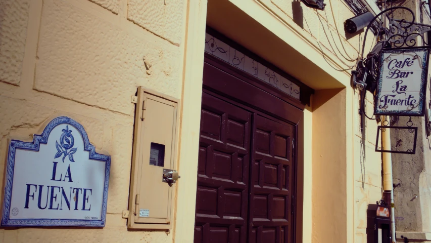 a wooden door and sign outside a building