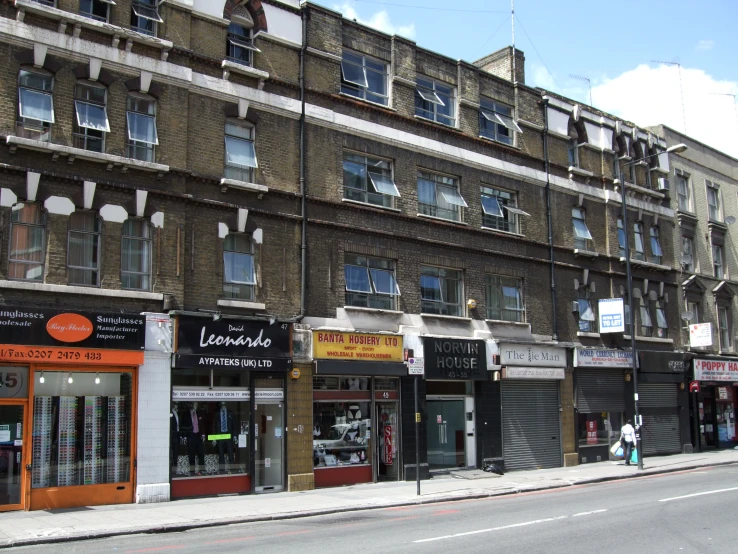 an image of commercial storefronts on the side of the road