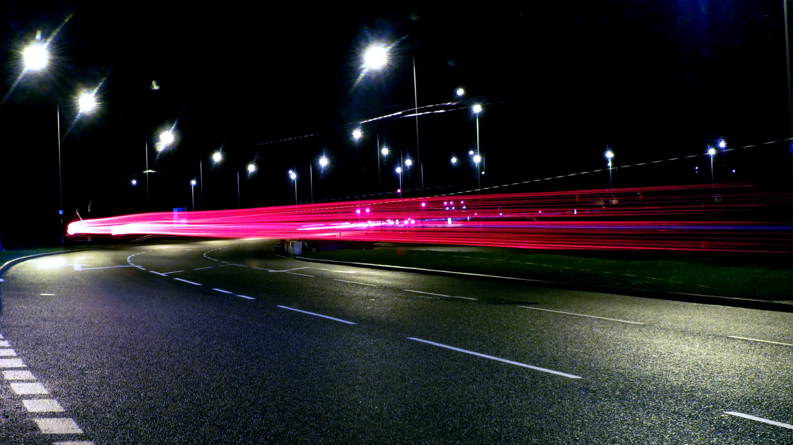 the light streaks are coming off of the building on the street