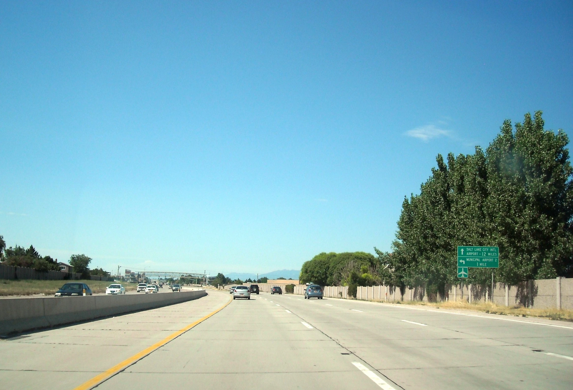 the traffic is traveling down the empty freeway