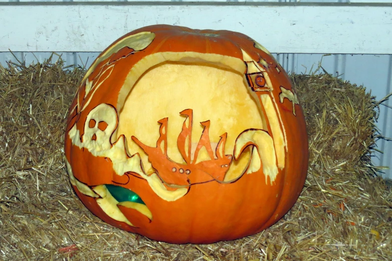 a carved pumpkin with an octo on top