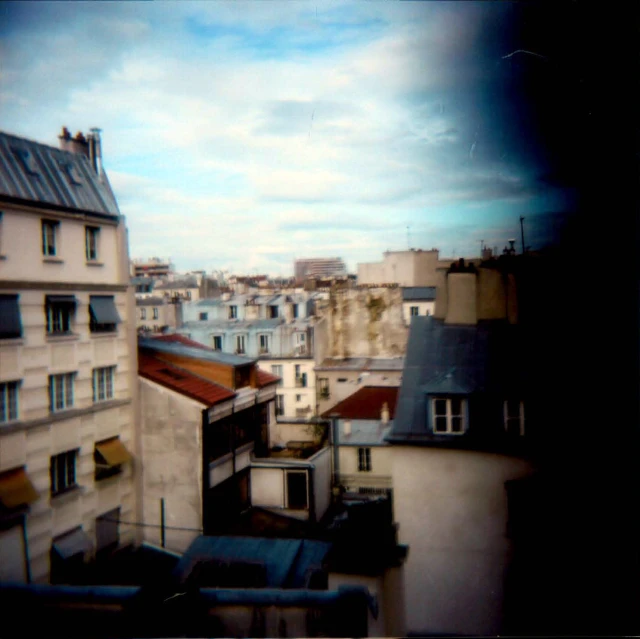 looking down at a rooftop from an apartment building