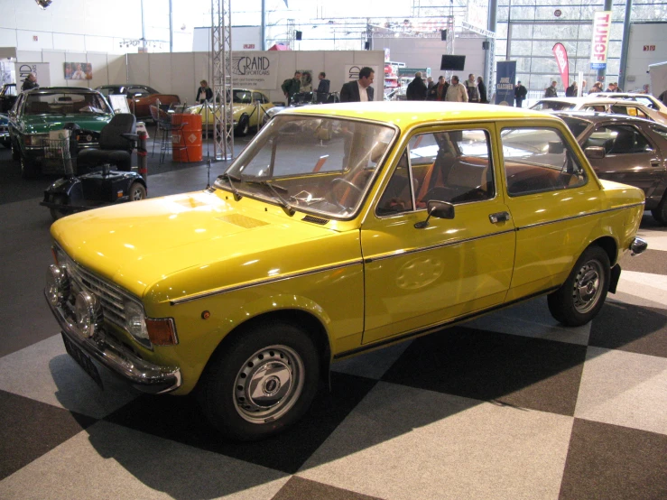 old cars are sitting on display at a car show