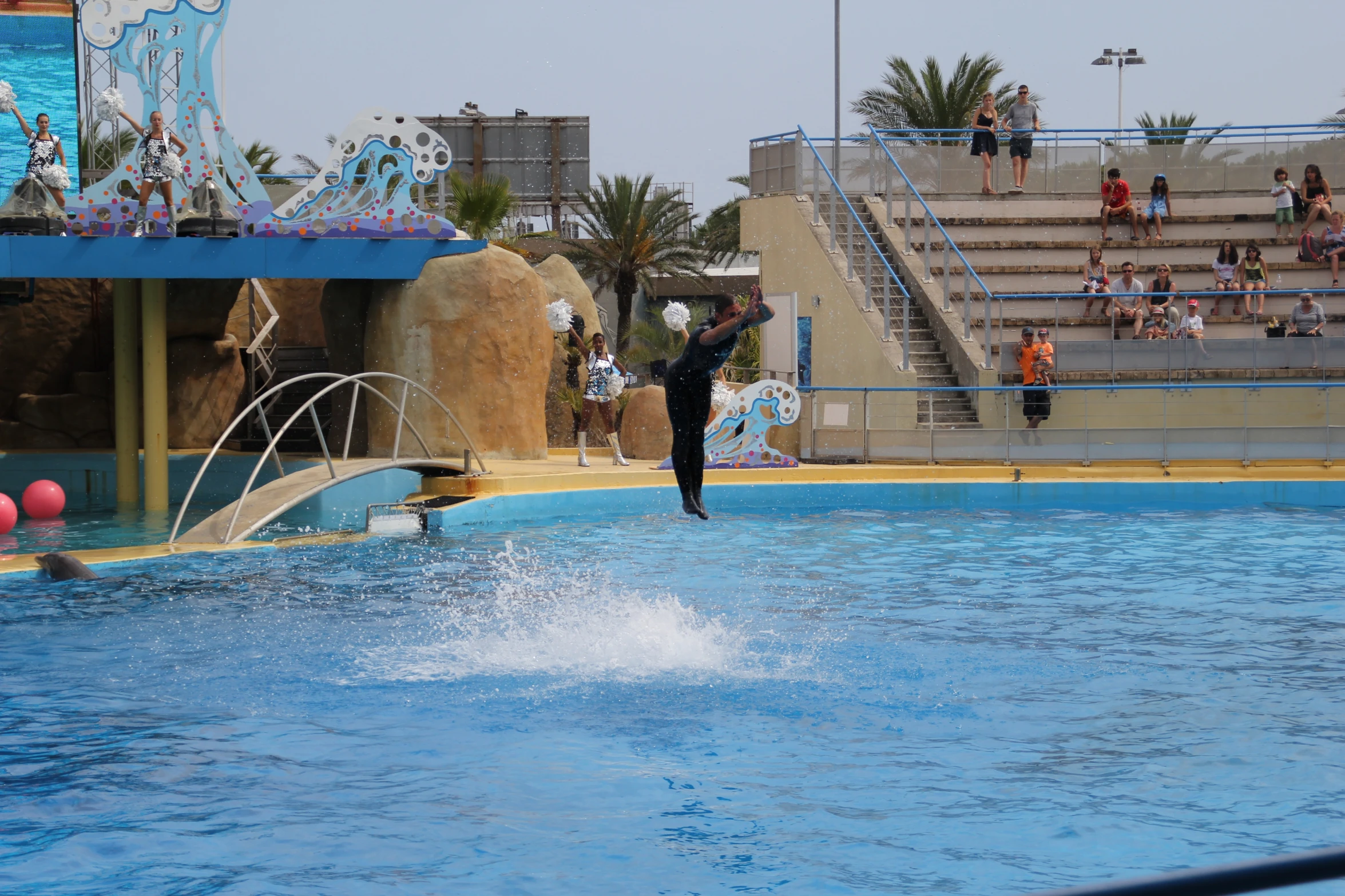 a man on a surf board in a swimming pool