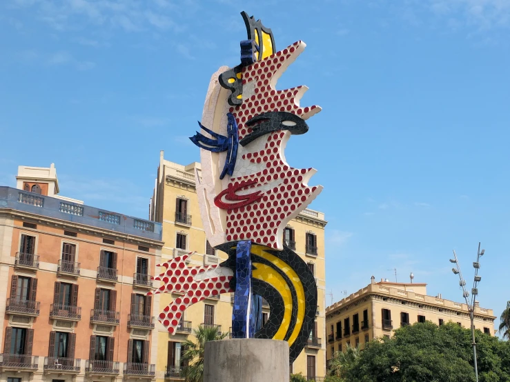 the large statue stands out against the sky